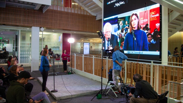 USC student asking a question on live television at a CPF climate forum event at USC Annenberg.